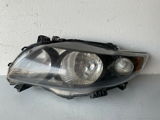 2009-2010 Toyota Corolla Headlight Lamp Left Diver Side LH Black Trim OEM