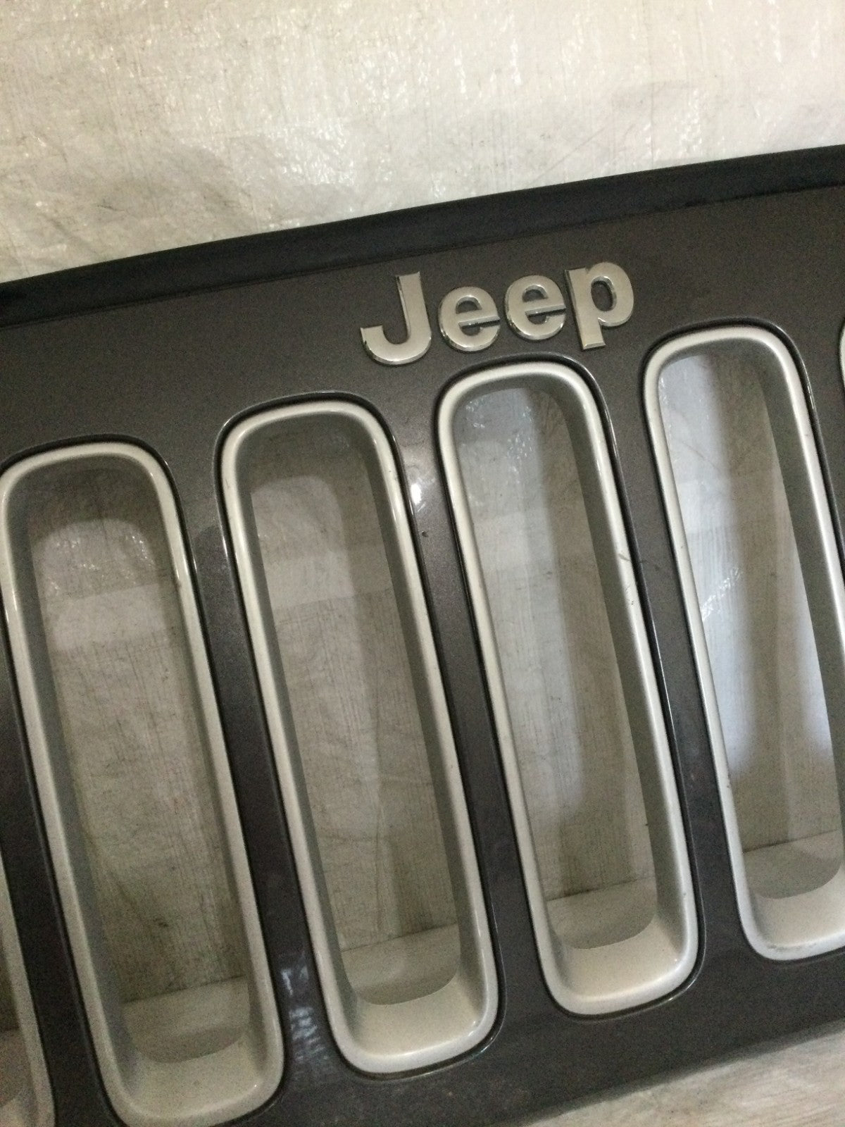 2007-2018 Jeep Wrangler JK Grille OEM 5NB84TRM MARKED DAMAGE LOOK PHOTO